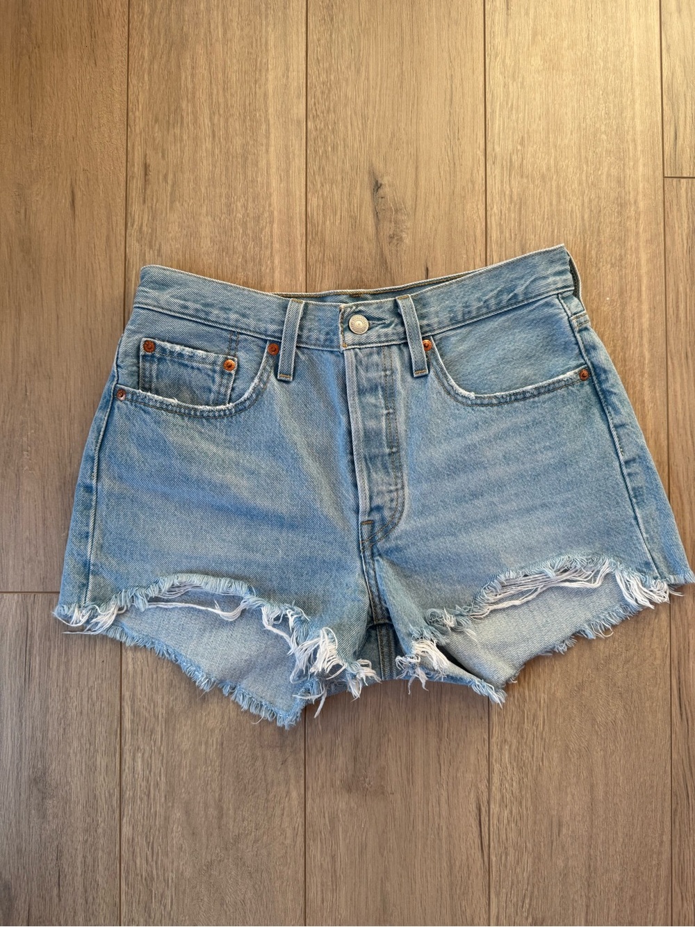 Levi’s 501 Distressed Denim Shorts (Light Blue)